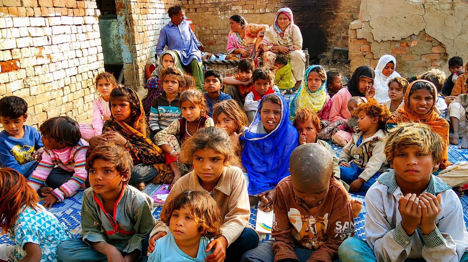 Children and families gathered at a Chopan Trust community programme in Pakistan